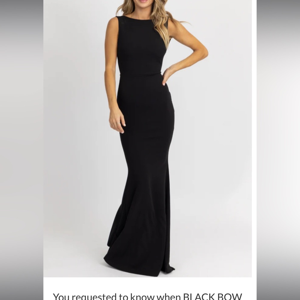 Black long dress. Backless with bow detail.